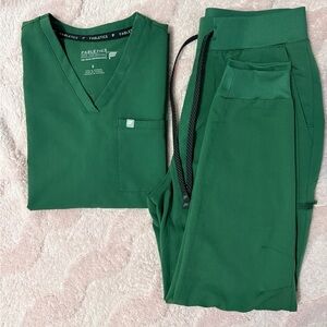 Fabletics scrubs set in color Hunter Green